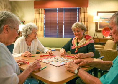 people playing a board game